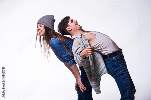 Couple of hip-hop dancers isolated on white,having fun