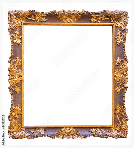 Antique gilded wooden frame on a white background is isolated photo