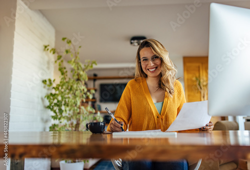 Adult woman, doing her taxes on time. photo