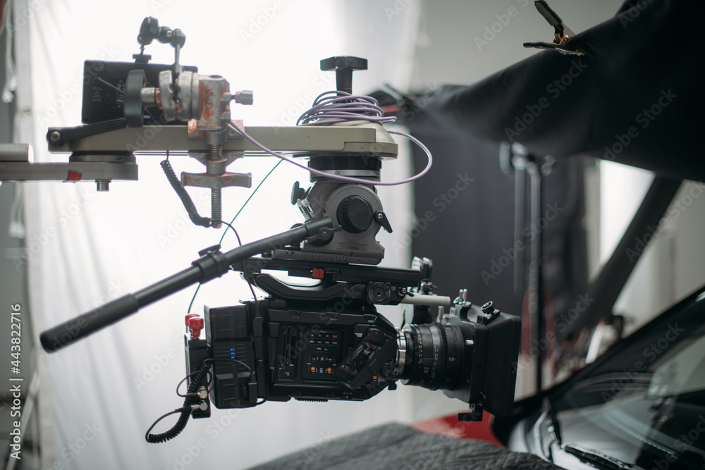 Professional cinema and video camera on the set. Shooting shift, lighting fixtures, shooting equipment and the team. Professional cinema and video camera on the set. Shooting shift, lighting fixtures, shooting equipment and the team.