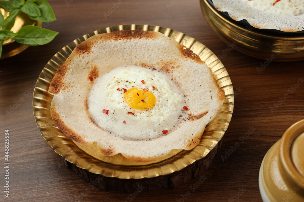 Sri lankan egg hopper, bittara aappa Appam popular breakfast Pancake Made With Fermented Rice Batter, Coconut Milk Sri Lanka South Indian Kerala, Tamil Nadu. Indian veg food. Sri lankan egg hopper, bittara aappa Appam popular breakfast Pancake Made With Fermented Rice Batter, Coconut Milk Sri Lanka South Indian Kerala, Tamil Nadu. Indian veg food.