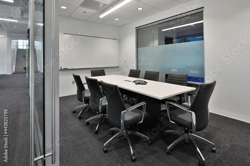 Fotografie Interior view of office business conference room with black office chairs and la