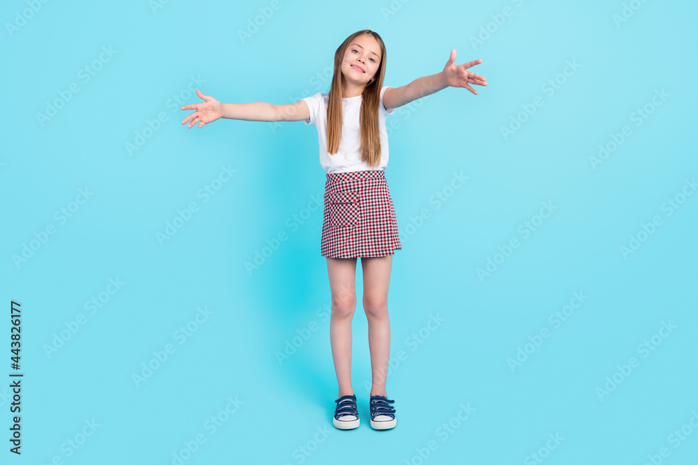 Full body photo of pretty brown hair little girl want hug wear white t-shirt skirt isolated on blue color background