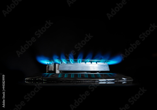 Gas flame on a gas stove with black background photo