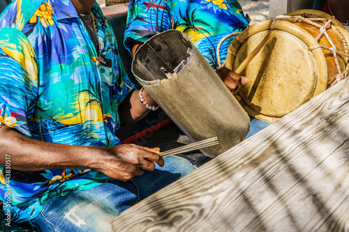 Dominican Republic. The beach musician plays the drum. Drummer. Close-up of a hand and a drum. Merengue. Dominican people. photo