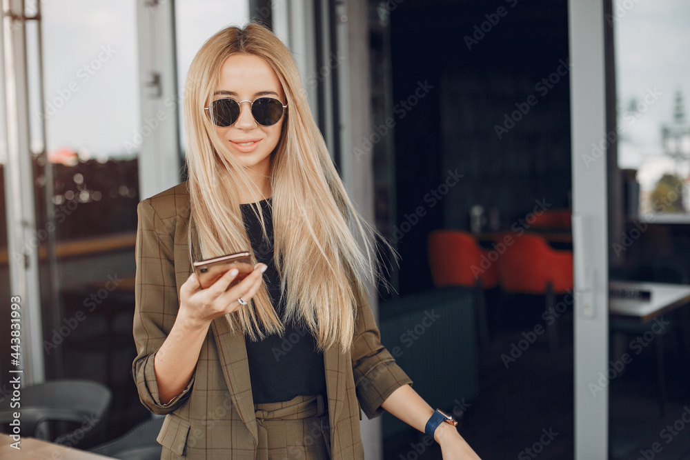 Fototapeta premium Elegant businesswoman working in a city
