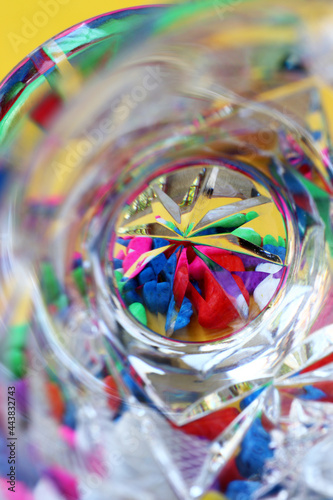 close-up of colorful confetti in crystal glass
