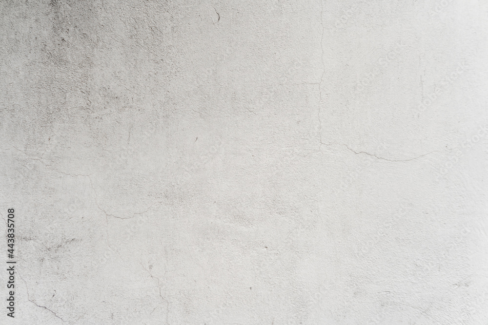 Fototapeta premium White wall with mildew and humidity stains caused by age. Textured wallpaper background.