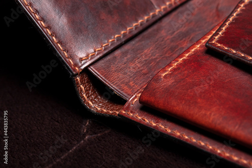 Part of a brown leather wallet or purse close-up.