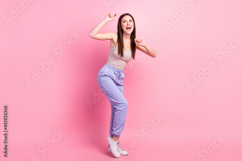 Fototapeta Naklejka Na Ścianę i Meble -  Full size photo of young happy excited good mood woman dancing enjoying free time isolated on pink color background