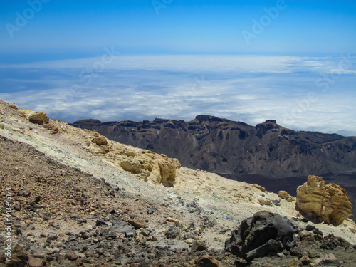 View from the slope of the volcano on the caldera and the layer of clouds below