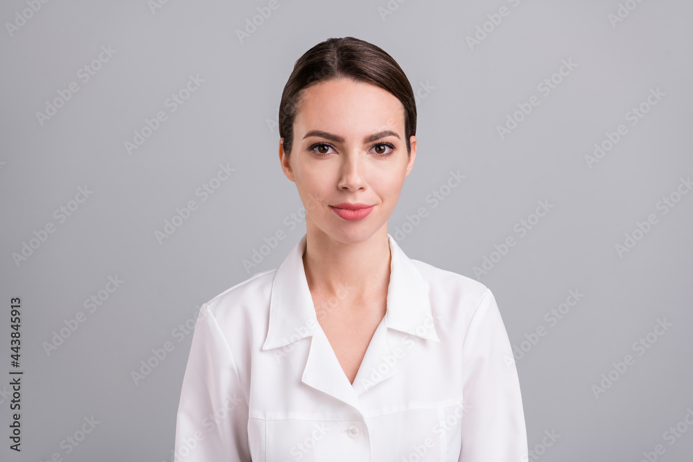 Photo of adorable pretty young doc woman dressed white coat smiling isolated grey color background Photo of adorable pretty young doc woman dressed white coat smiling isolated grey color background