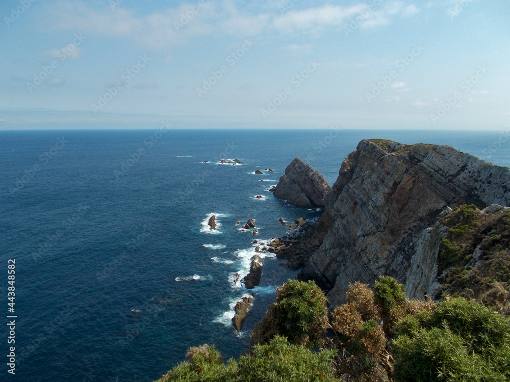 Cliff at the Cabo de Peñas Lighthouse, Asturias, in Spain. Europe. Horizontal photography.