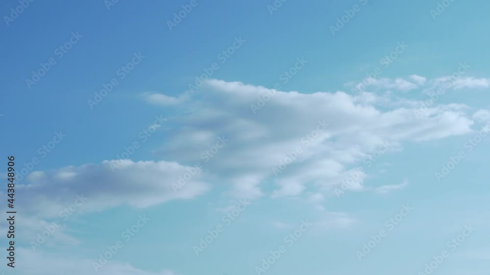 Serene Blue Sky and White Clouds, Beautiful 4K Lapse Time. Background of Clear Blue Sky and White Clouds on a Sunny Day. Peace, Serenity, Air, Atmosphere, Good Weather Forecast, Religion. Serene Blue Sky and White Clouds, Beautiful 4K Lapse Time. Background of Clear Blue Sky and White Clouds on a Sunny Day. Peace, Serenity, Air, Atmosphere, Good Weather Forecast, Religion.