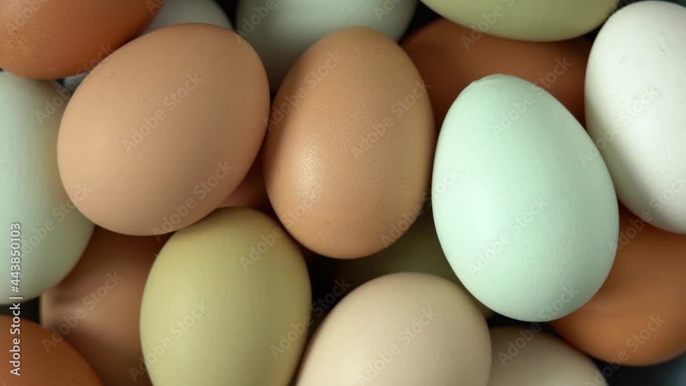 Fresh raw chicken eggs rotate in circle. Natural, healthy farm food. Rustic products. Poultry Fresh raw chicken eggs rotate in circle. Natural, healthy farm food. Rustic products. Poultry