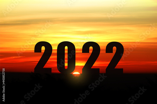 Silhouette landscape with sunlight and 2022 years for background of celebrating new year