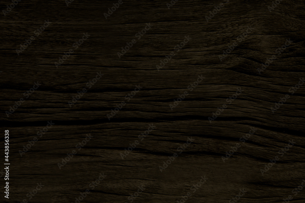 Old dark brown wood wall crack pattern on surface for background and texture Old dark brown wood wall crack pattern on surface for background and texture