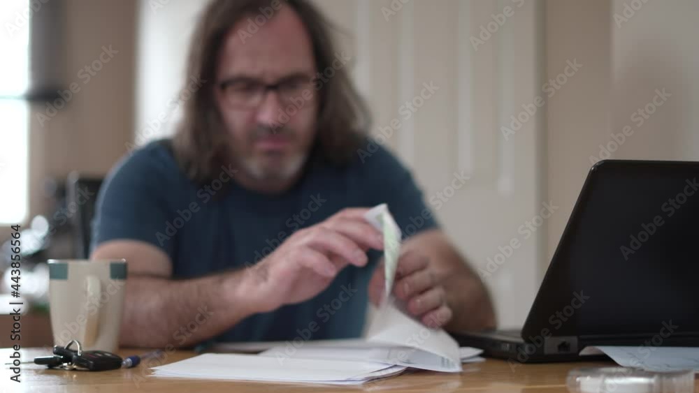 Man Reading a DEATH ANNOUNCMENT Letter and Getting Upset and Sad Man Reading a DEATH ANNOUNCMENT Letter and Getting Upset and Sad