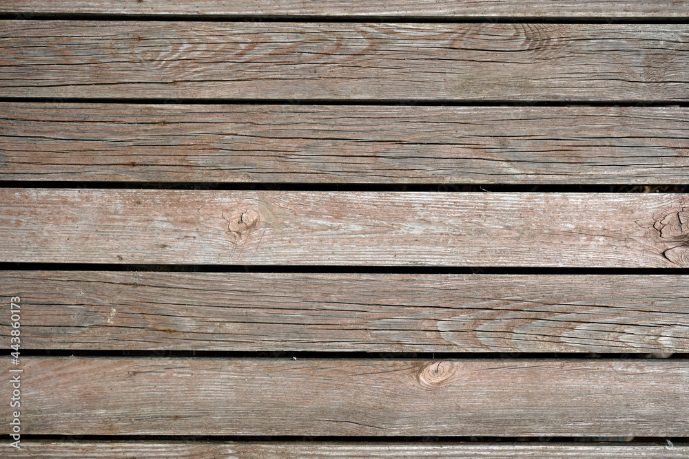 The texture of natural materials. Boardwalk pier on the river bank in the rain and sun The texture of natural materials. Boardwalk pier on the river bank in the rain and sun