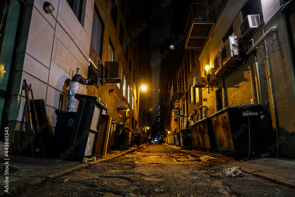 dark urban alleyway with dim lights in the city dark urban alleyway with dim lights in the city