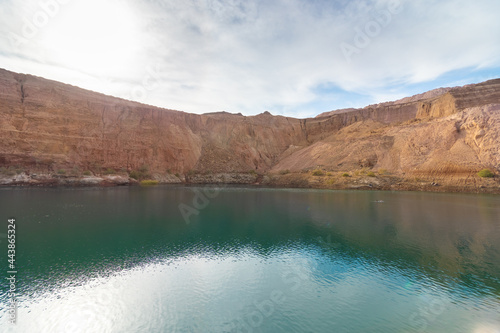 hdr of a huge crater in an old copper quarry full of water, in the hidden lake in Timna Park, southern Israel