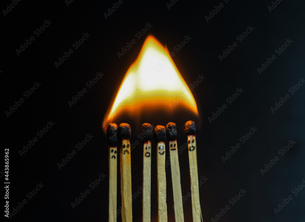 Group of a red match burning isolated with the background. Row burning matchstick in the chain reaction. Matchstick art photography. Group of a red match burning isolated with the background. Row burning matchstick in the chain reaction. Matchstick art photography.