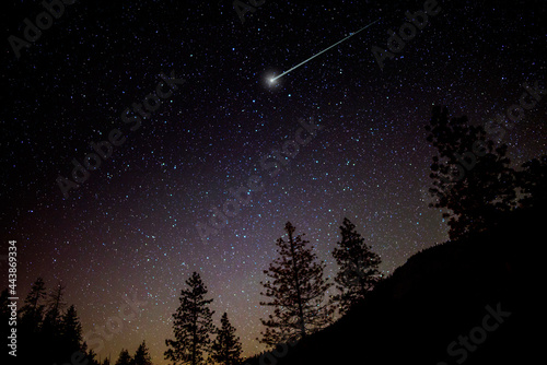 Starry night sky and shooting star photo