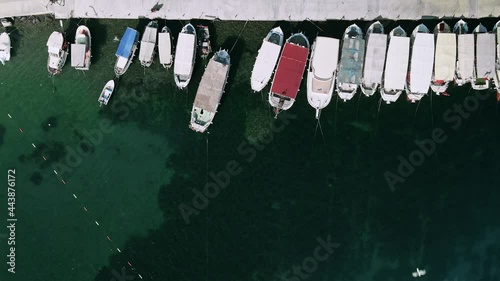 Top view of the pier with boats in the sea harbor