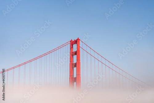 Golden Gate Bridge in the fog, photo taken from the embankment, San Francisco #443877161