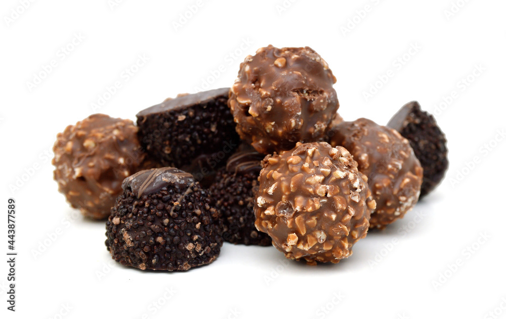 Chocolate candies collection. Beautiful Belgian truffles isolated on white background Chocolate candies collection. Beautiful Belgian truffles isolated on white background