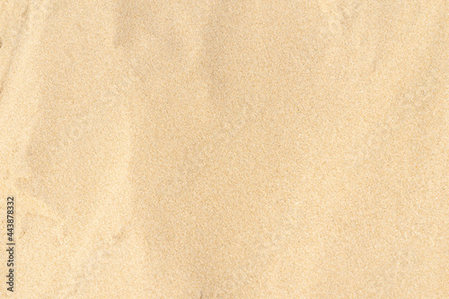 Sand pattern texture in tropical beach. Brown sand for background.