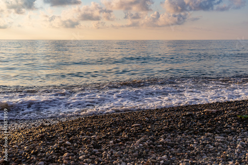 Calm sea and pebble beach. The most common photograph of the sea