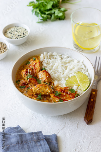 Chicken tikka masala curry with rice, herbs and peppers. Indian food. National cuisine.