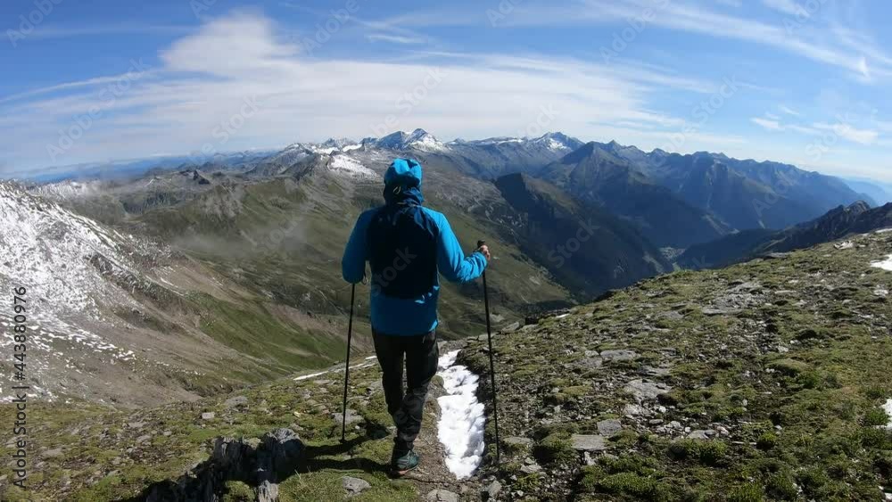 A man in blue jacket hiking to Feld Lake, Hohe Tauern in Austria. The trail is very steep and covered with snow. Early spring hiking. He is using hiking sticks. High mountains around. Calmness
A man in blue jacket hiking to Feld Lake, Hohe Tauern in Austria. The trail is very steep and covered with snow. Early spring hiking. He is using hiking sticks. High mountains around. Calmness