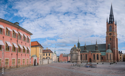 Photography The church Riddarholmskyrkan on the island Riddarholmen at the old town Gamla Stan in Stockholm at sunset a summer day
