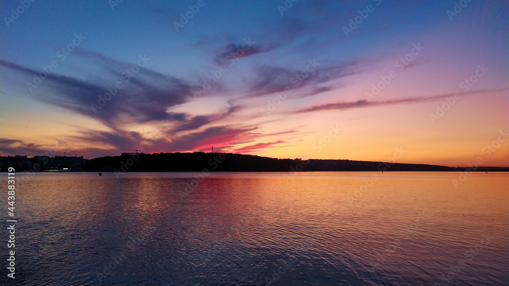 Naklejka premium Magic colored sunset on the evening lake