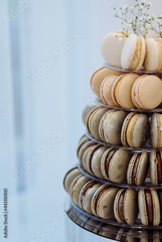 Pyramid of caramel and chocolate macarons at a wedding candy bar