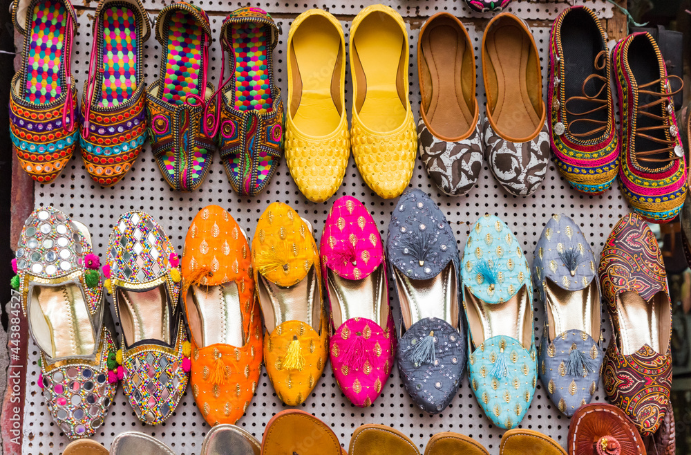 Traditional colorful indian shoes on a market in Jaipur
