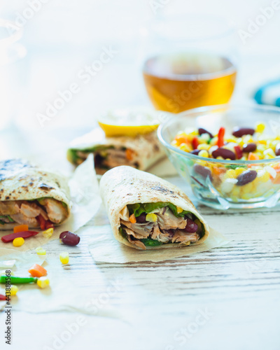 Traditional Mexican Food -  Burrito, on white wooden retro table