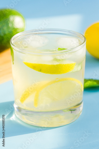 Homemade lemonade on blue background