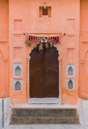 Decoration above a door of an old house in Orchha photo