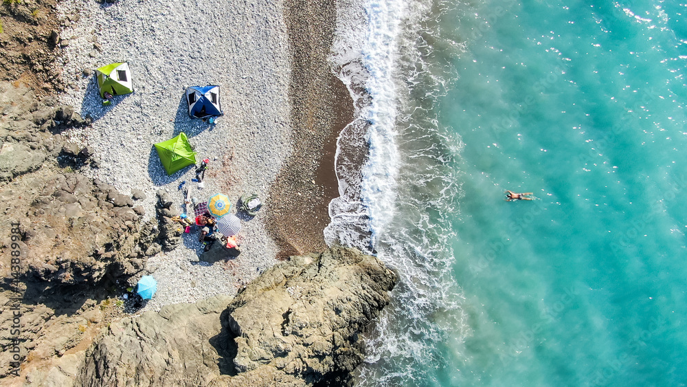 Obraz premium The coast of Cyprus, near the city of Paphos. Top view of the sea, mountains and the beach. Camping, camping with tents in nature.