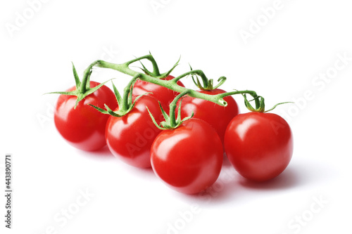 Composition of fresh ripe cherry tomato branches isolated on white background © PANDA