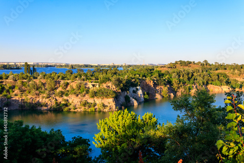 View of beautiful flooded granite quarry near the Dnieper river in Chykalovka village near Kremenchug, Ukraine