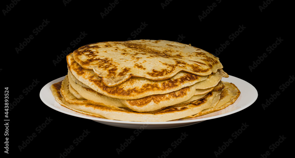 pancakes on a plate on a black background pancakes on a plate on a black background