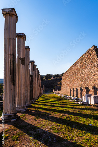 View of the columns in the city of Asklepion in a vertical frame and blue sky