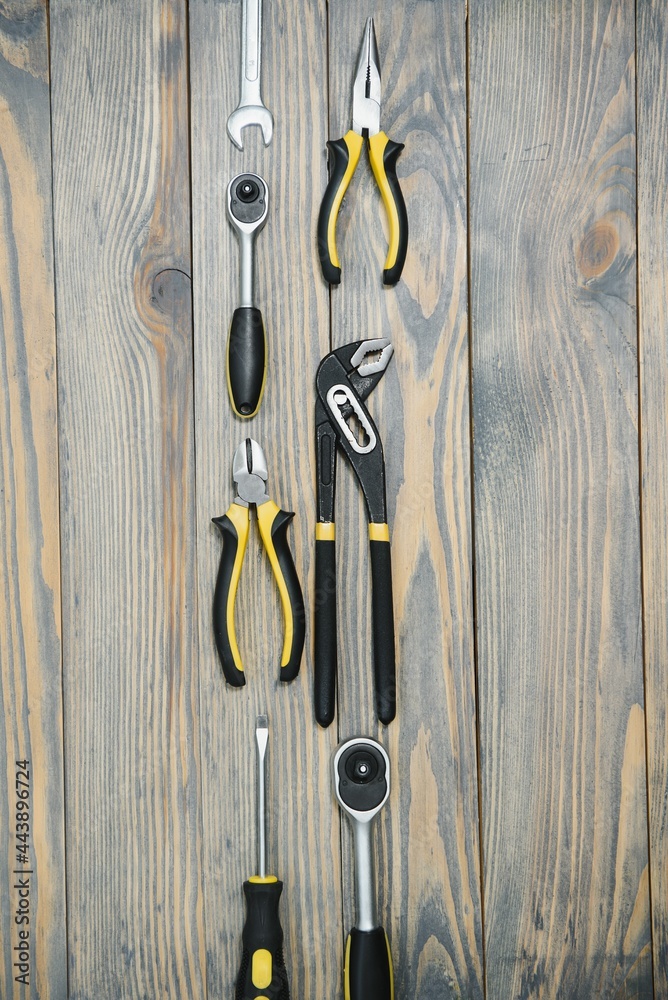Various tools on wooden background Various tools on wooden background