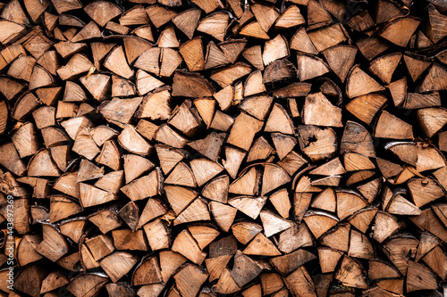 textured firewood background of chopped wood for kindling and heating the house. a woodpile with stacked firewood. the texture of the birch tree photo