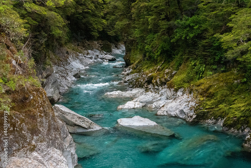 Colorful blue mountain river at the Haast pass  New Zealand