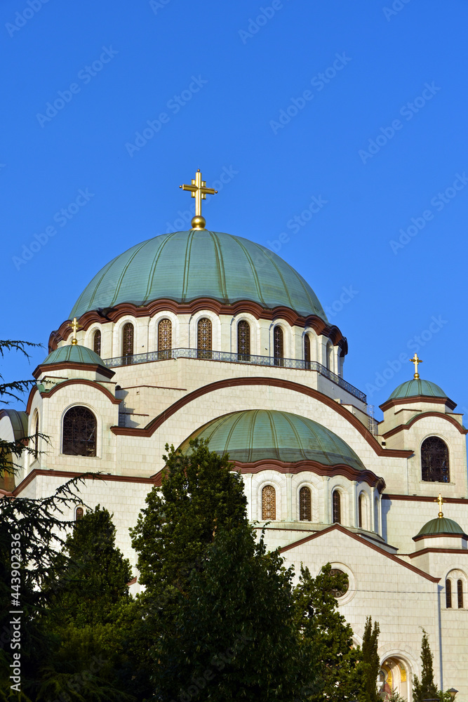 The Temple of Saint Sava (Sveti Sava) - Serbian Orthodox church with clear blue sky in the background. Shot in day time during the golden hour.